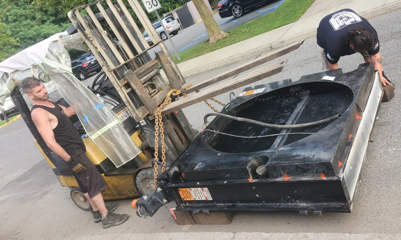 Loading in a Mack truck radiator at Acme