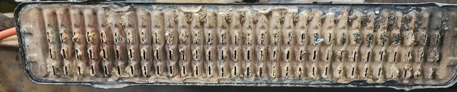 Radiator header tubes clogged with corrosion