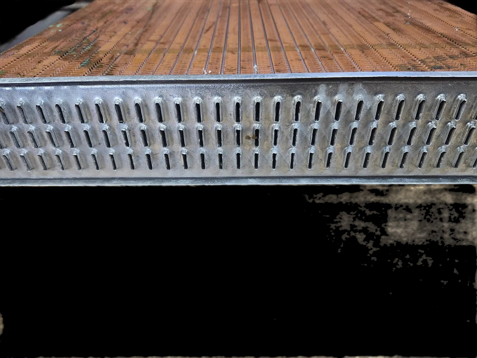 Close-up of radiator header tubes with corrosion