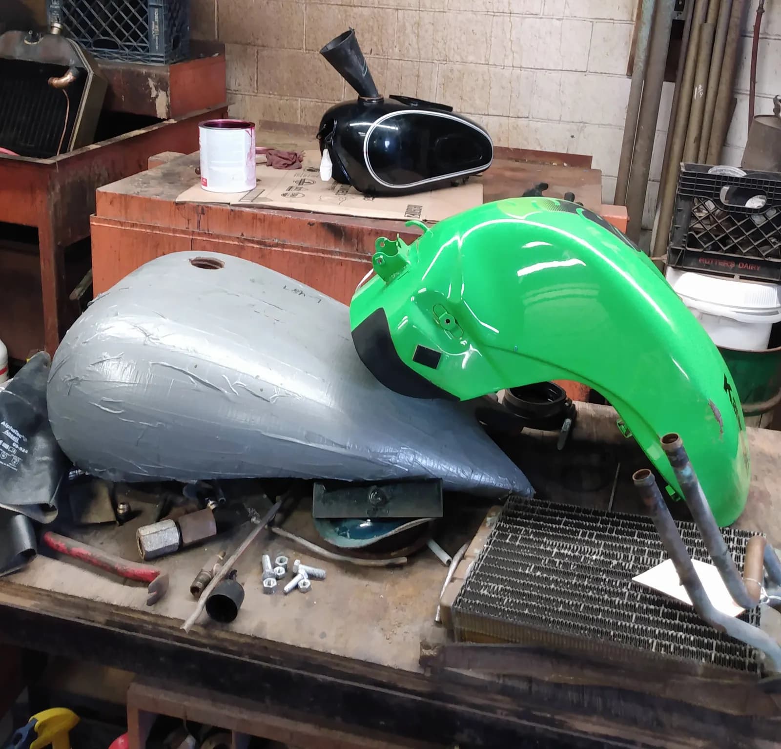Lots of motorcycle tanks being rebuilt