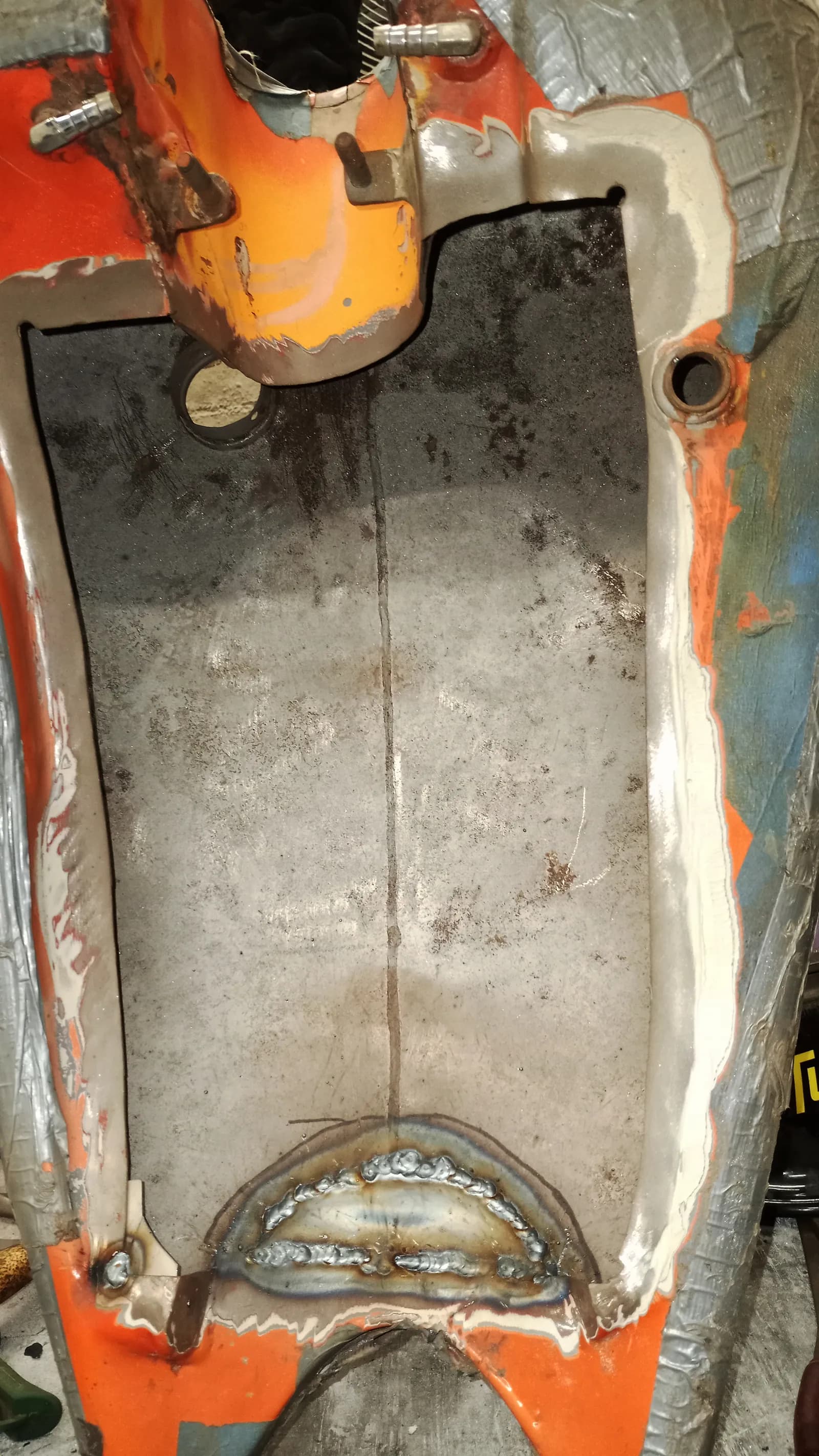 Motorcycle tank cleaned out, ready to weld back together