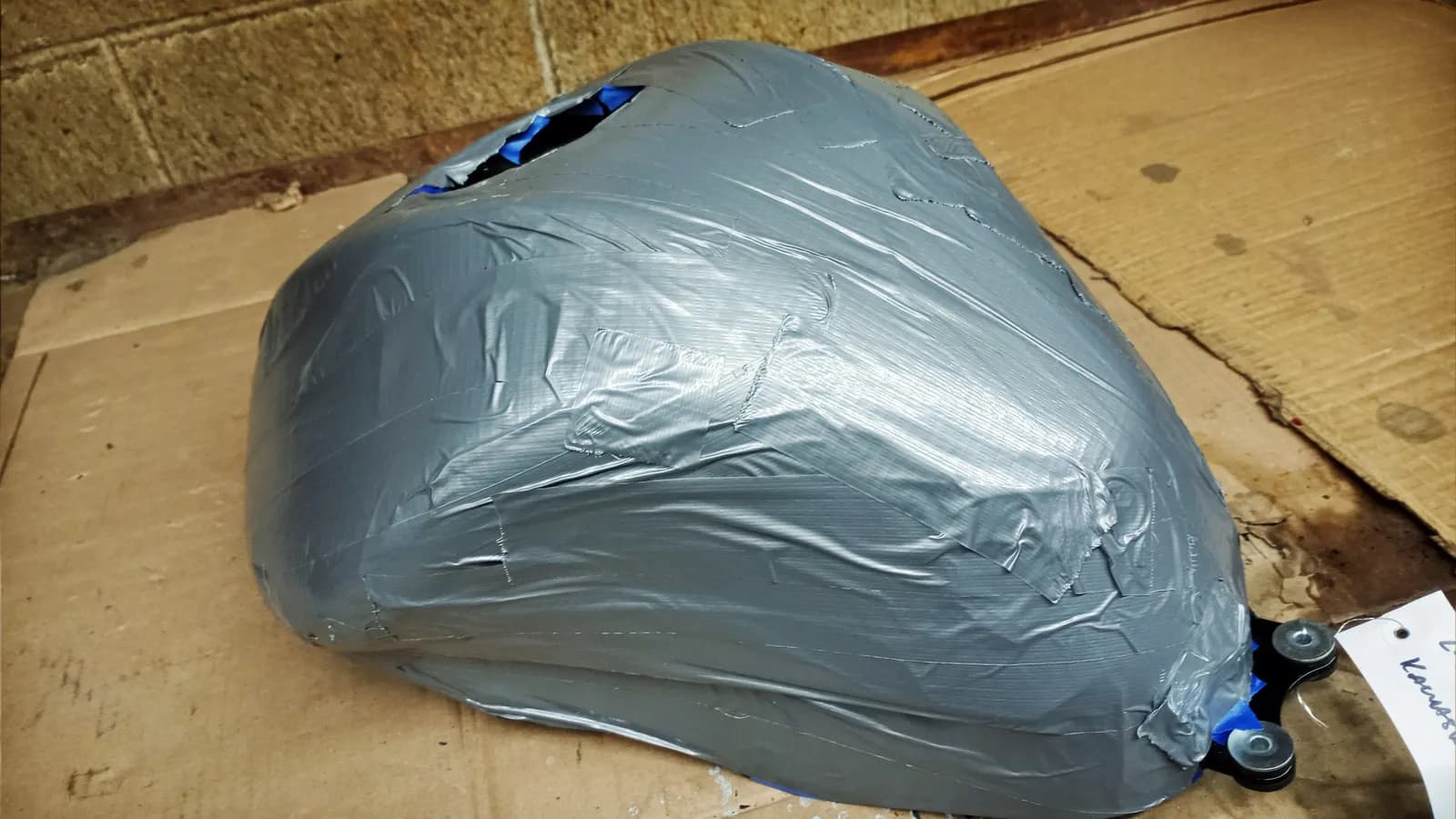 To protect your paint from acid, we apply multiple layers of tape before cleaning
